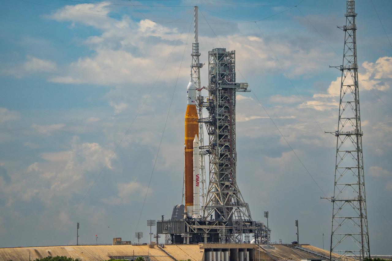 NASA’s Space Launch System (SLS) rocket with the Orion spacecraft aboard is seen atop the mobile launcher at Launch 39B at NASA’s Kennedy Space Center in Florida. Artemis I mission is the first integrated test of the agency’s deep space exploration systems: the Space Launch System rocket, Orion spacecraft, and supporting ground systems. The mission is the first in a series of increasingly complex missions to the Moon. Launch of the uncrewed flight test is targeted for no earlier than Aug. 29 at 8:33 a.m. ET. With Artemis missions, NASA will land the first woman and first person of color on the Moon, using innovative technologies to explore more of the lunar surface than ever before.